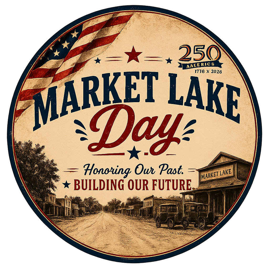 The image is a circular commemorative logo for Market Lake Day, celebrating America&rsquo;s 250th anniversary (1776&ndash;2026). The logo has a vintage, weathered appearance with a cream-colored background and a red and blue border. An American flag drapes across the upper-left portion of the circle. Centered prominently are the words &ldquo;Market Lake Day,&rdquo; with &ldquo;Market Lake&rdquo; in large blue block letters and &ldquo;Day&rdquo; in red script. Beneath the title is the slogan, &ldquo;Honoring Our Past. Building Our Future.&rdquo; The bottom half of the logo contains a sepia-toned illustration of a historic small-town main street, featuring wooden storefronts, a dirt road, mature trees, and antique automobiles parked in front of a building labeled &ldquo;Market Lake.&rdquo; The overall design emphasizes community pride, local history, and the nation&rsquo;s semiquincentennial celebration.